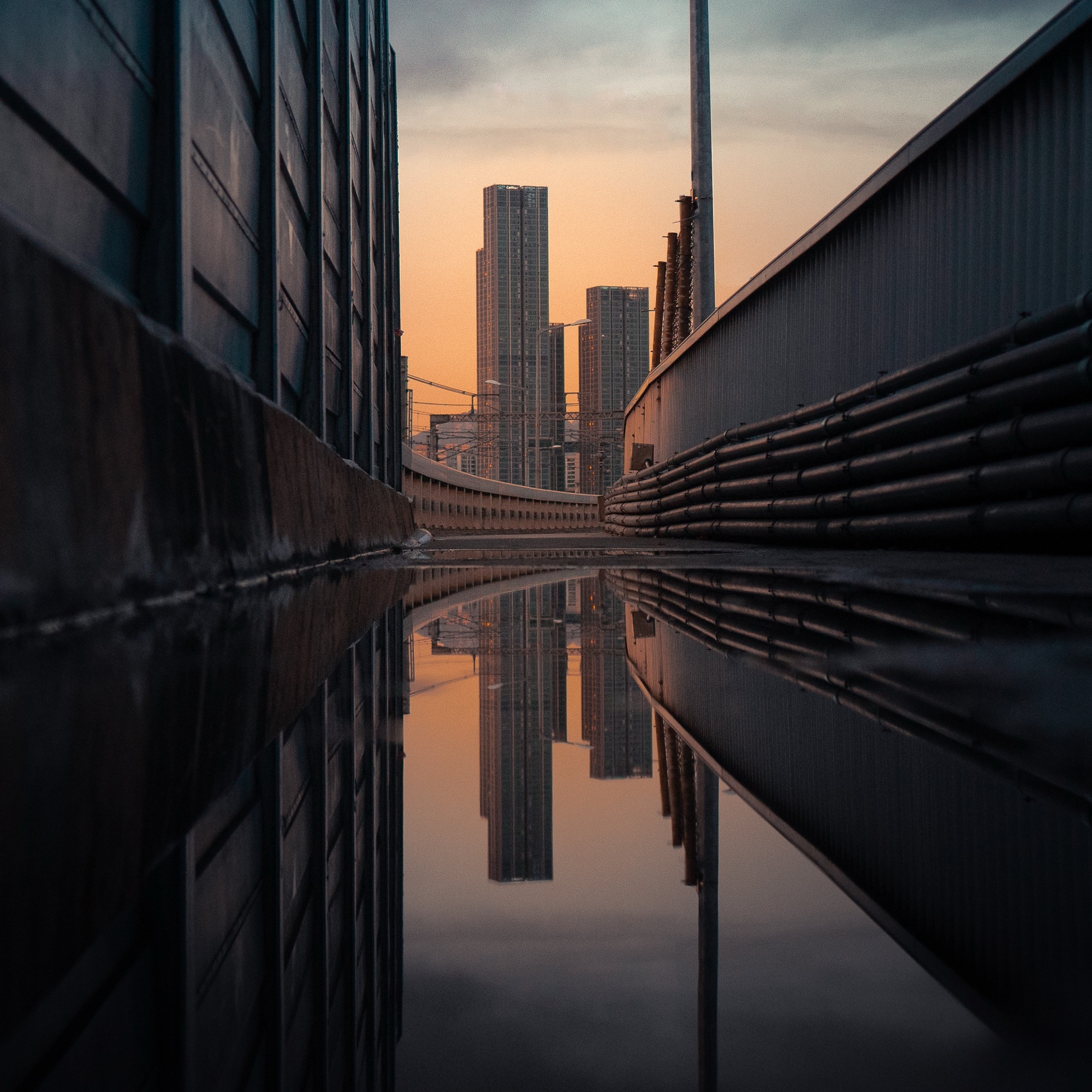 Seoul skyline reflected in rainwater